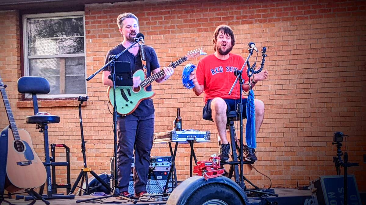 Aaron Traffas and Keegan Han playing acoustic live music in southern Kansas