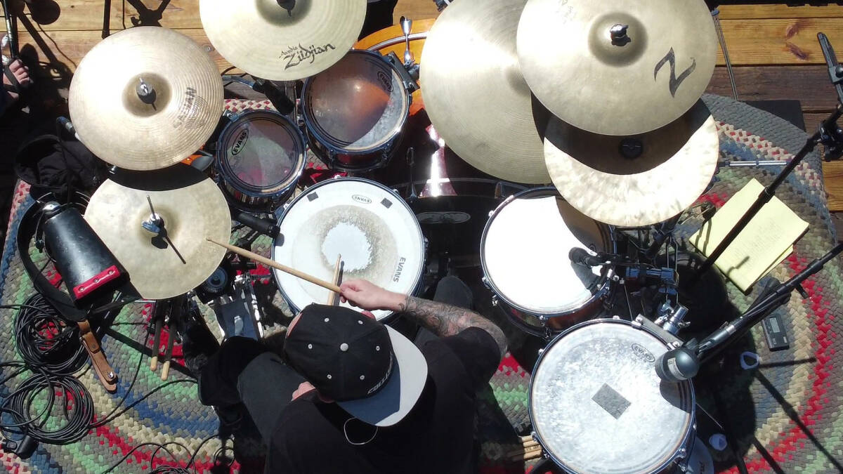 Mason Powell playing drums in southern Kansas on classic rock song